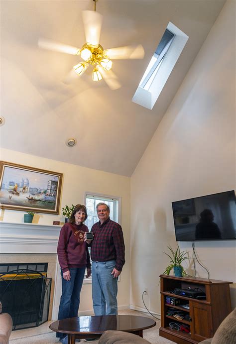 The loft is useless in terms of space. Raleigh couple's living room transformed after replacing old bubble skylights