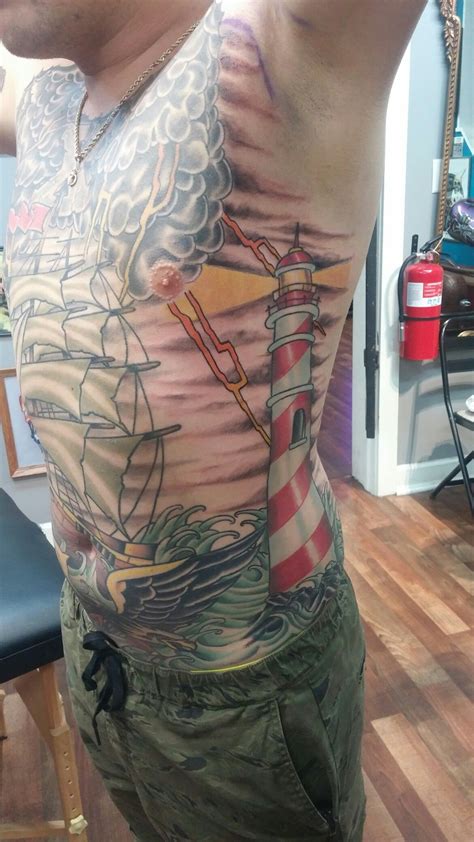 Refresh the old black ink with a beautiful mix of color, blurring the lines with fresh hues. Traditional lighthouse tattoo | Traditional lighthouse ...