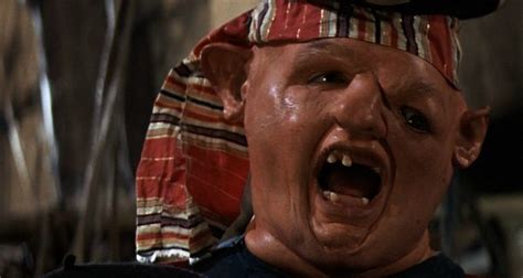 He has brown curly hair and blue eyes. How To Dress For Your Body If You're Sloth From The Goonies