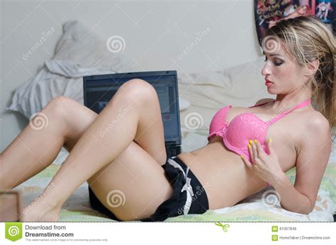 She didn't expect such a short dick, at least his performance wasn't short. Busty Brunette Lying On A Bed With A Laptop Stock Photo ...