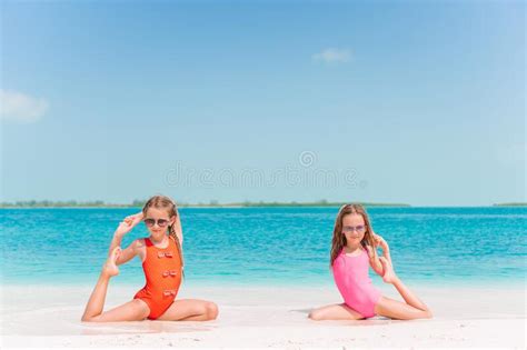 After a few drinks, things heat up real fast, with the two girls. Two Little Happy Girls Have A Lot Of Fun At Tropical Beach ...