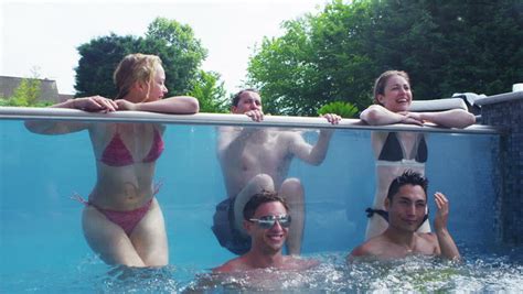 Watch premium and official videos free online. Excited Group Of Young Friends Enjoying A Pool Party At ...
