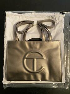 The cost remains the same across all colors. Telfar Medium Bronze Shopping Bag - IN HAND -NEW COLOR ...