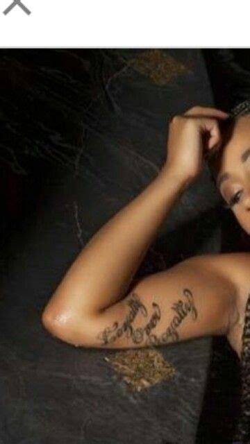 Cardi b's 8 tattoos & their meanings. Cardi B Arm Tattoo...Love Cardi B!! | B tattoo, Arm ...