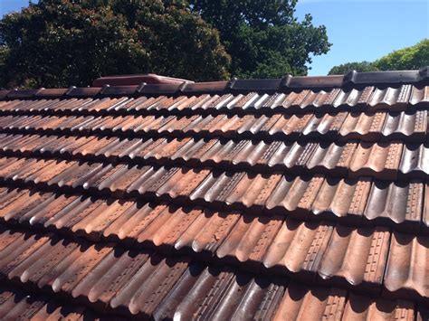 Start at the furthermost point and work backwards, this ensures that you are walking on a dry surface. Terracotta Tile Roof Restoration - Rainshield Roofing