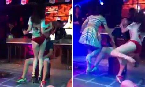 Strippers work the crowd with their sultry movies and hot bodies on stage. Dancer gives guy a lap-dance in club -- only for his angry ...