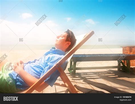 Evolution movie trailer, boys on film 6: Boy Rests Lounge On Beach. Sea Azov Image & Photo | Bigstock