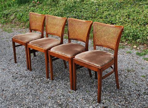 A natural wood finish on the solid wood frame and legs provides a warm touch to this 2 piece dining chair set. Tribute 20th Decor: Caned Back Dining Chairs