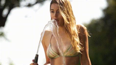 Busty ebony teen unwraps her gorgeous tits. keeley hazell playing with water gif | WiffleGif