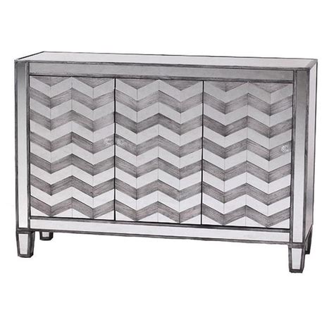 It's very roomy with two doors that open up to 3 sliding drawers in the middle, and 3 removable wire baskets on each side of the drawers. Chevron Mirrored Three Door Cabinet | Chevron mirror ...