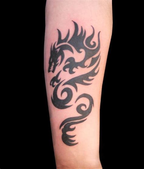 Tattoos are vastly gaining a lot of popularity among different types of for those people making a choice for more elaborate designs, the use of fantasy tattoos depicting dragons, mermaids black skeleton whale forearm tattoo. Dragon Forearm | Dragon tattoos for men, Tribal tattoos ...