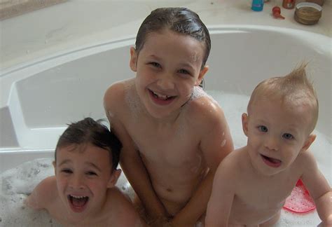 Bathing babies shortly after birth began when births were moved from homes to hospitals, said dr. three kids in a tub 1 | zigama1000 | Flickr