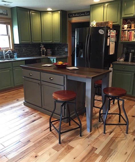 Small modern kitchen island with seating and backsplash. Item 167 Kitchen Island with Seating and Tapered Legs ...