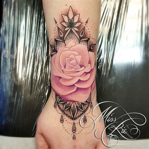 So elegant rose arm tattoos for girls | rose tattoo on arm. Pretty in pink rose tattoo on the hand done by ...