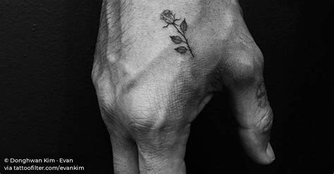 Best hand tattoo designs and ideas. Small rose tattoo on the right hand.