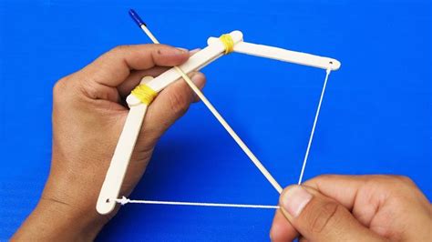 Use a pocketknife to cut a notch in the end of each arrow to help secure it on the string when you pull it back. How to Make a Mini Bow and Arrow | Bow and arrow diy, Mini ...