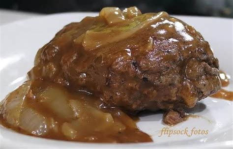 These southern hamburger steaks with onion mushroom gravy has the perfect combination of ingredients and seasonings that turn into one delicious dinner! Smothered Hamburger Steak | Just A Pinch Recipes