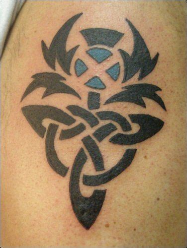 The tattoo was supposed to read family tradition but it's a train wreck. Scottish Celtic saltire thistle pride tattoo :) Alba Gu ...