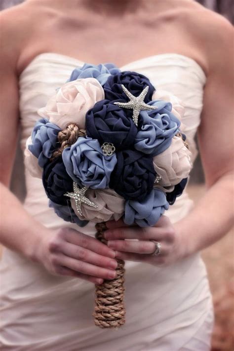 We work closely with brides and grooms to turn visions into reality. Unique, nautical and elegant, hand-sewn, large, fabric bridal bouquet, with or without rhi ...