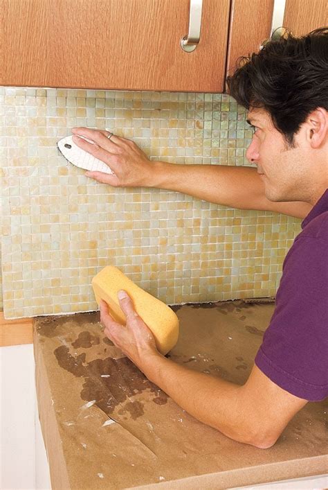 Cutting the mosaic tile sheets; How to Install a Glass Mosaic Tile Backsplash in 2020 ...