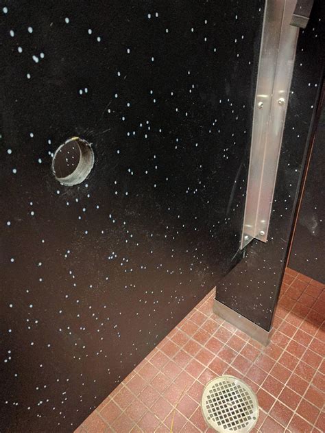 Someone drilled a glory hole in the 2nd floor men's bathroom in the IC : gatech