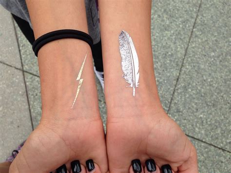 Any part of the body. Lighting bolt & feather wrist tattoo | Feather tattoo ...