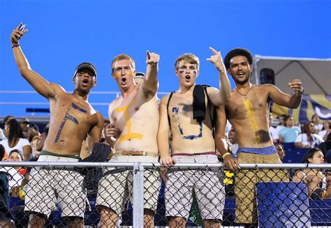 About as close to the line as you can get it. Hot college football fans in body paint - Outsports