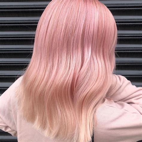 Colorful balayage for dark hair. @hair.by.craig_parkinson's pastel pink balayage is giving us ALL the #MeanGirlsDay hair goals ...