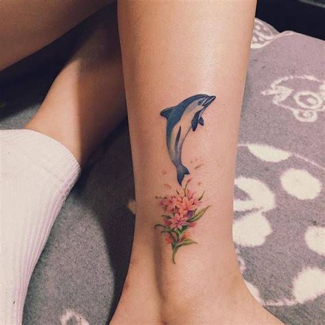 See more ideas about tattoos, body art tattoos, cool tattoos. Illustrative dolphin and flower tattoo on the right ankle. Tattoo artist: Nando | Dolphins ...