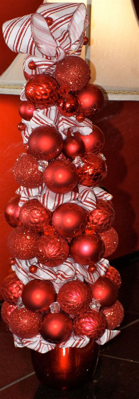 Press firmly on the wood, then add weights until the glue dries. Red Ornament with Candy Cane Ribbon Topiary | Peppermint ...