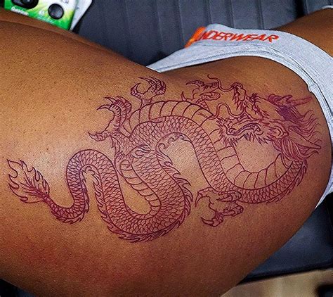 Chinese red dragon tattoo leg. Owner Of Satchmoe Art Studio on Instagram: "Red dragon on ...