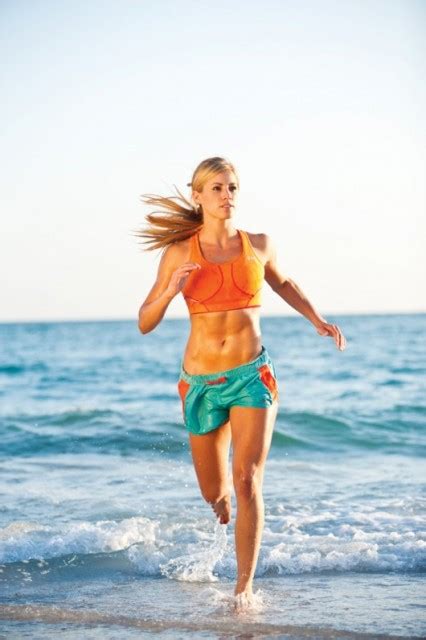 Woman measuring her waist on the beach. The Ultimate Summer Workout Plan for Women. Beach Body in ...