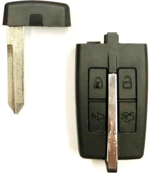 Locate the analog key hidden inside the key fob. 2012 Ford Taurus key fob push start PEPS Prox keyless ...