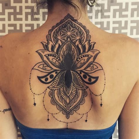 This is how pricing works. Blackwork upper back tattoo with lotus. #blackworktattoo # ...