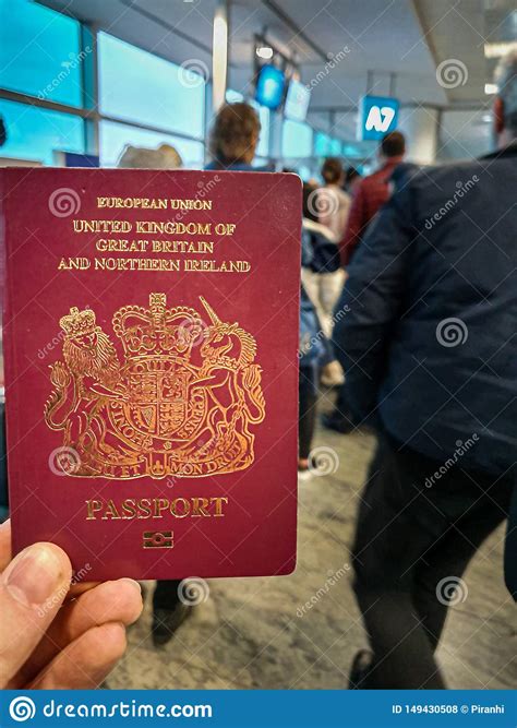 Several countries also released red lists, and one—tunisia—released an orange list. A White Male Holds His Red British Passport In His Hand In The Middle Of A Crowded Departure ...