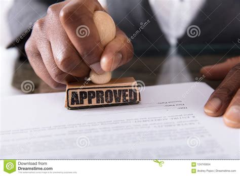 There is professional fee for snp and another professional fee for loan agreement. Person`s Hand Stamping On Approved Contract Form Stock ...