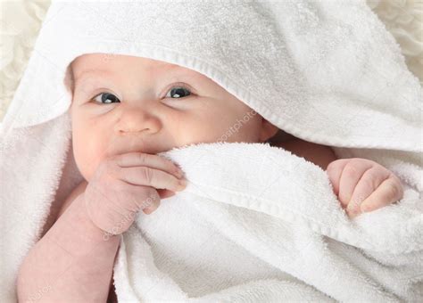 The warm water can soothe the episiotomy repair and it can also help to ease the tension and fatigue that go along with having a new baby at home. Baby after bath — Stock Photo © teraberb #4596352