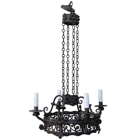 Make an offer on a great item today! Spanish Four-Light Wrought Iron Chandelier For Sale at 1stdibs