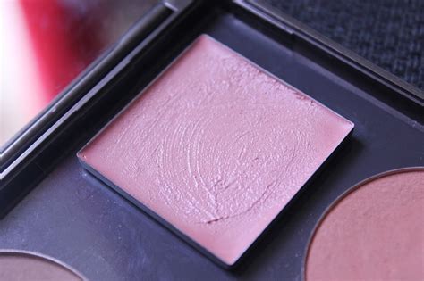 A plummy taupe leaves cheeks a subtly shimmering glow, perfect for pale to medium skin. Muffin in The Coffin: Kjaer Weis Cream Blush in Embrace