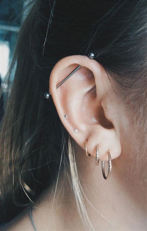 While the name industrial piercing sounds rather boring and technical, it's far from that. Industrial piercing, silver and rose gold #CostumeJewelry ...