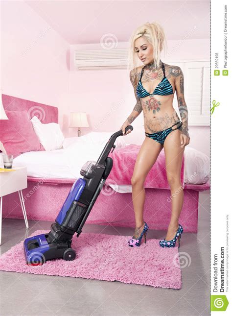 Maybe you would like to learn more about one of these? Young Tattooed Woman In Bikini Vacuuming Bedroom Stock ...