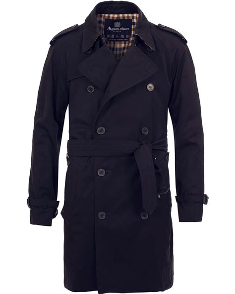 Crafted from a cotton blend, a classic, short trench coat. Aquascutum Corby Double Breasted Trenchcoat Navy hos ...