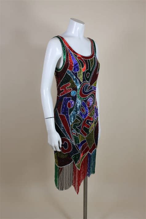 ٥ جمادى الآخرة ١٤٤٣ هـ. 1980's Oleg Cassini Beaded Alphabet Cocktail Dress at 1stdibs