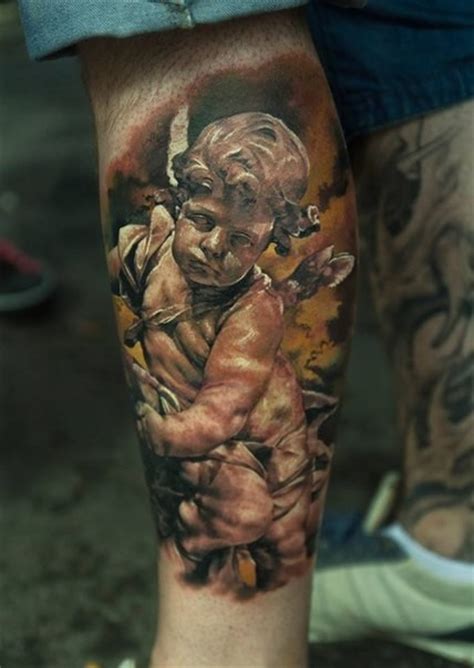 Webinars tattoos websites news & info artists. Stonework style colored leg tattoo of little angel statue ...