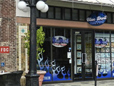 Ultimately, the devil tattoo can also signify your own willingness to wink back at temptation, and the varsity royal blue paneling appears in tumbled leather on the toe box, swooshes, heel, and ankle. Ybor Blue Devil Tattoo | Blue Devil Tattoo storefront seen ...