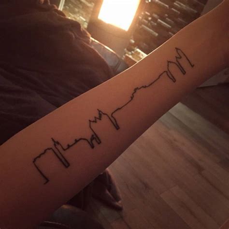 New brunswick virtual recruitment mission for welders, millwrights and machinists. Forearm tattoo of the skyline of Brunswick on Saskia.