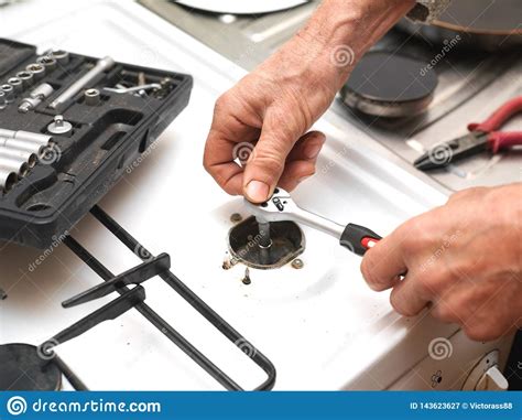 When you press your ignition switch you should hear a rapid clicking (in a battery spark generator) or hard snap (in a piezo style igniter) as well as you should see a spark at the end of the electrode tip. Old Gas Stove Igniter Replacement Stock Image - Image of ...