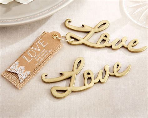 A vintage corkscrew in the shape of a giant skeleton key! Love Antique Gold Bottle Opener Wedding Favors