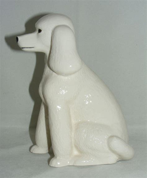 The ageless tale of a beautiful young princess whose jealous stepmother orders her killed so that she will be 'the fairest in the land.' Quail Ceramics White Poodle Money Box