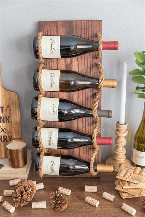 How do you hang a wine rack? Chic DIY Rustic Wine Rack With Rope - Shelterness